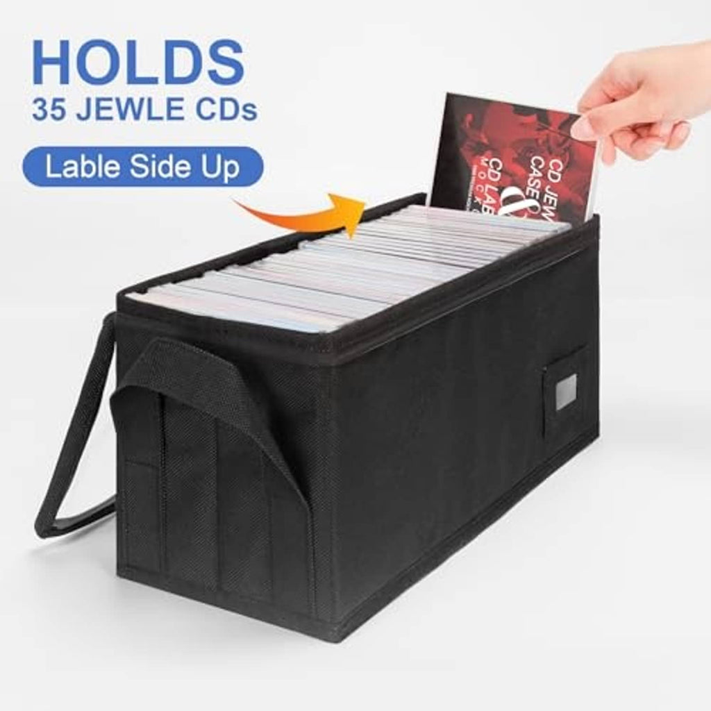 Open black CD storage box with handle, holding stacked jewel cases label-side up