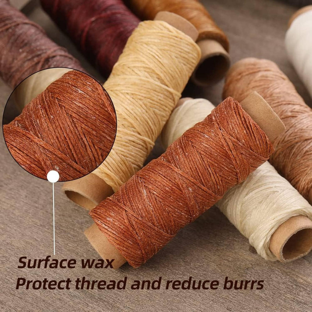 Close-up waxed thread spools in rust orange, tan, cream, and dark brown