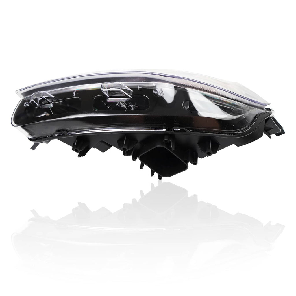 Black headlight housing with clear outer lens and internal reflector components, side view