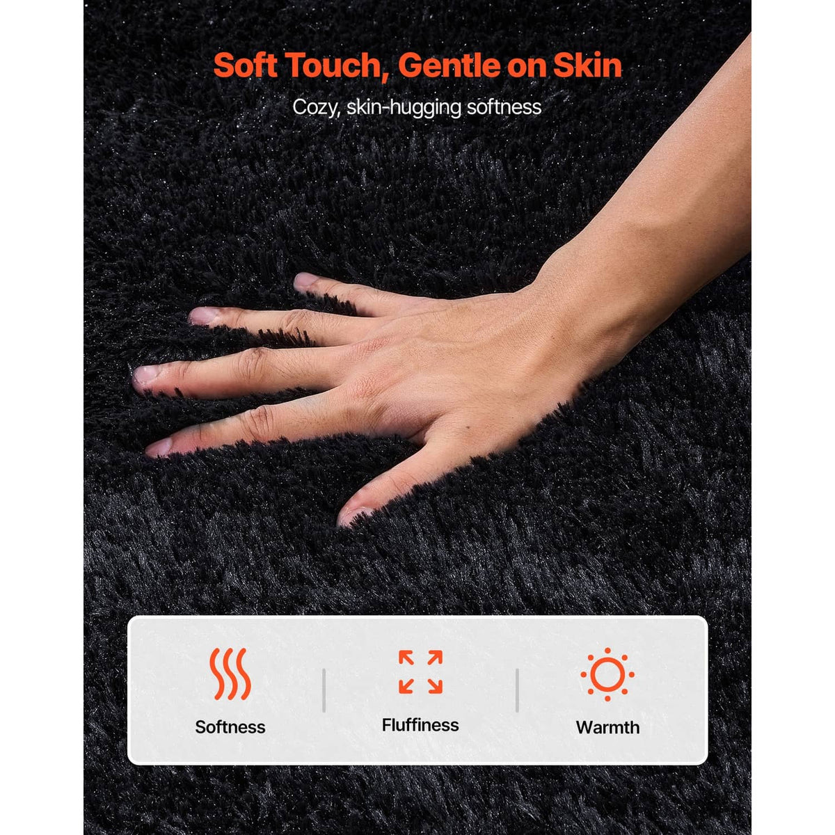 Black plush area rug with a hand pressing into the shag surface for softness