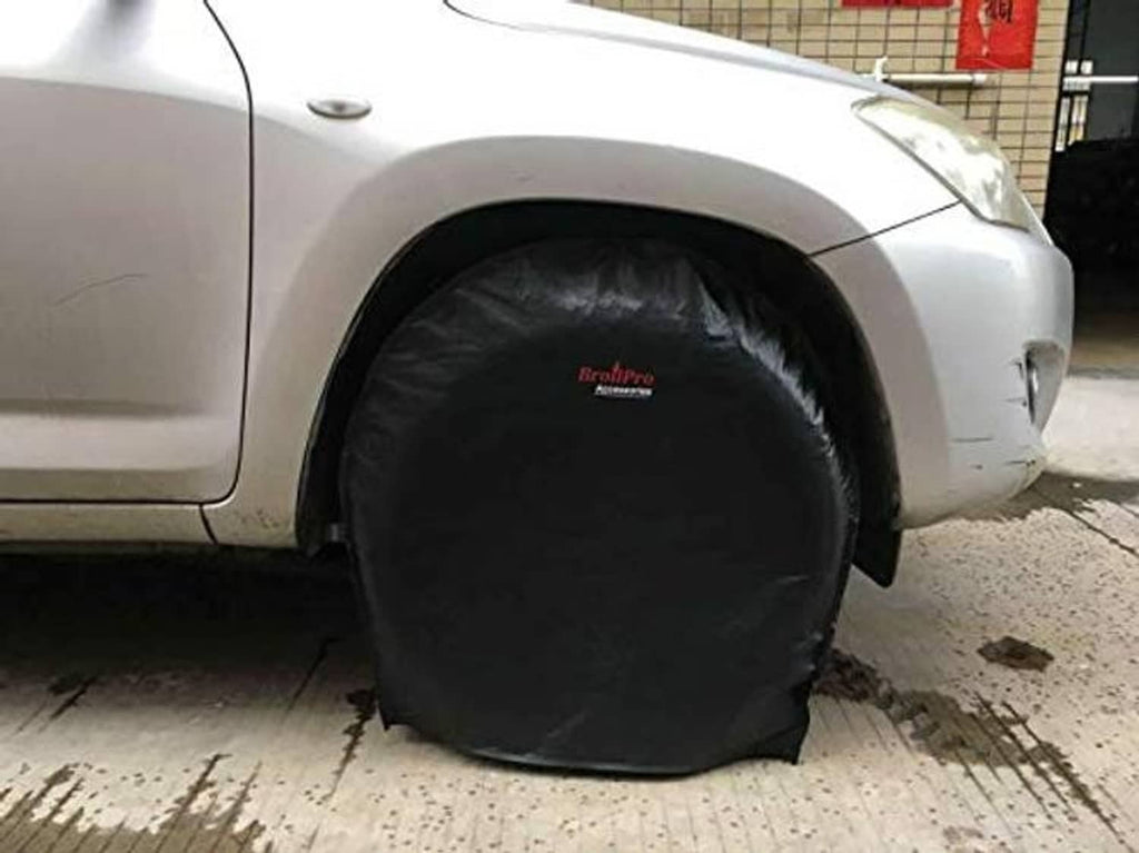 Black half-round tire cover fitted on an RV wheel, snug over the tire