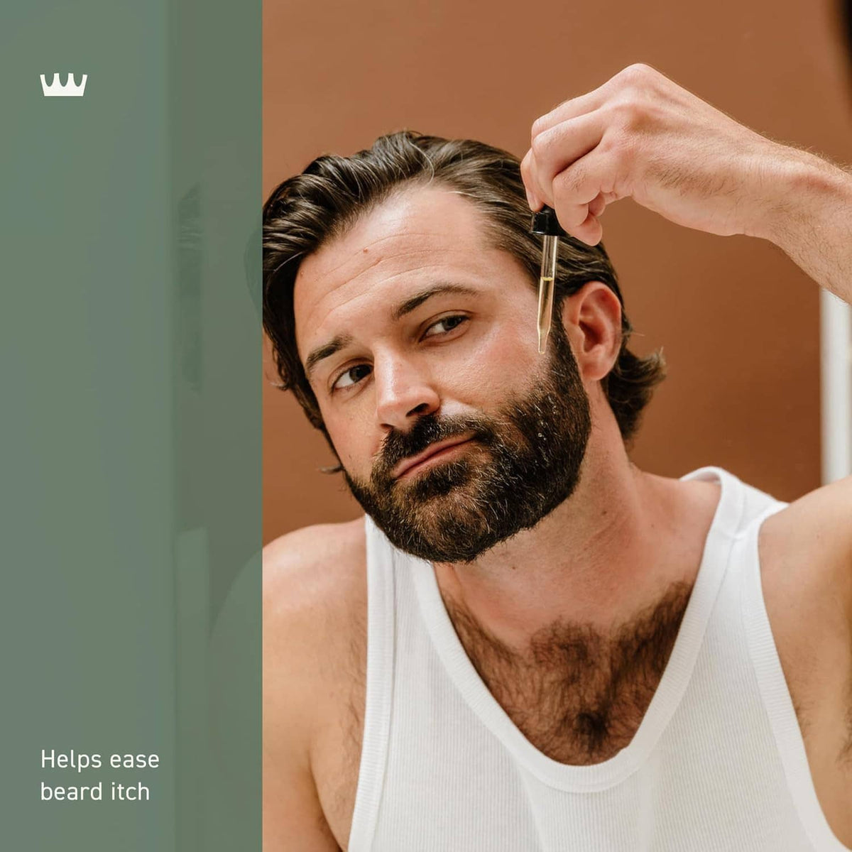 Man with beard having oil applied near ear, Cremo beard oil theme product styling