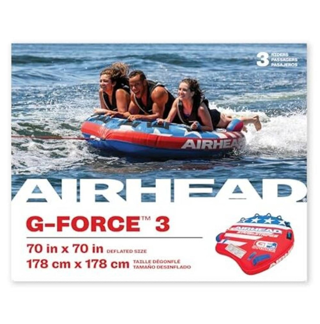 Inflatable towable tube in use with three riders, red-and-blue stars-and-stripes design