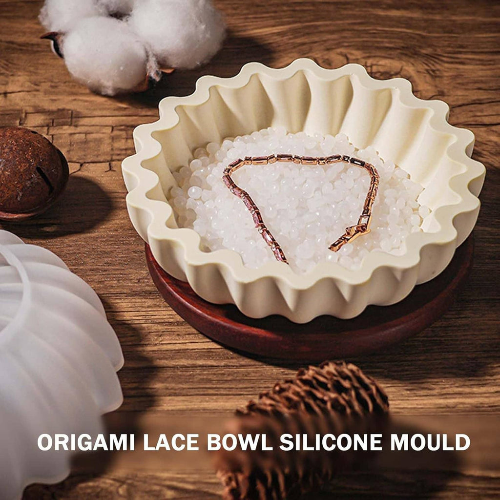 White scalloped silicone bowl mold holding a heart-shaped crystal resin design