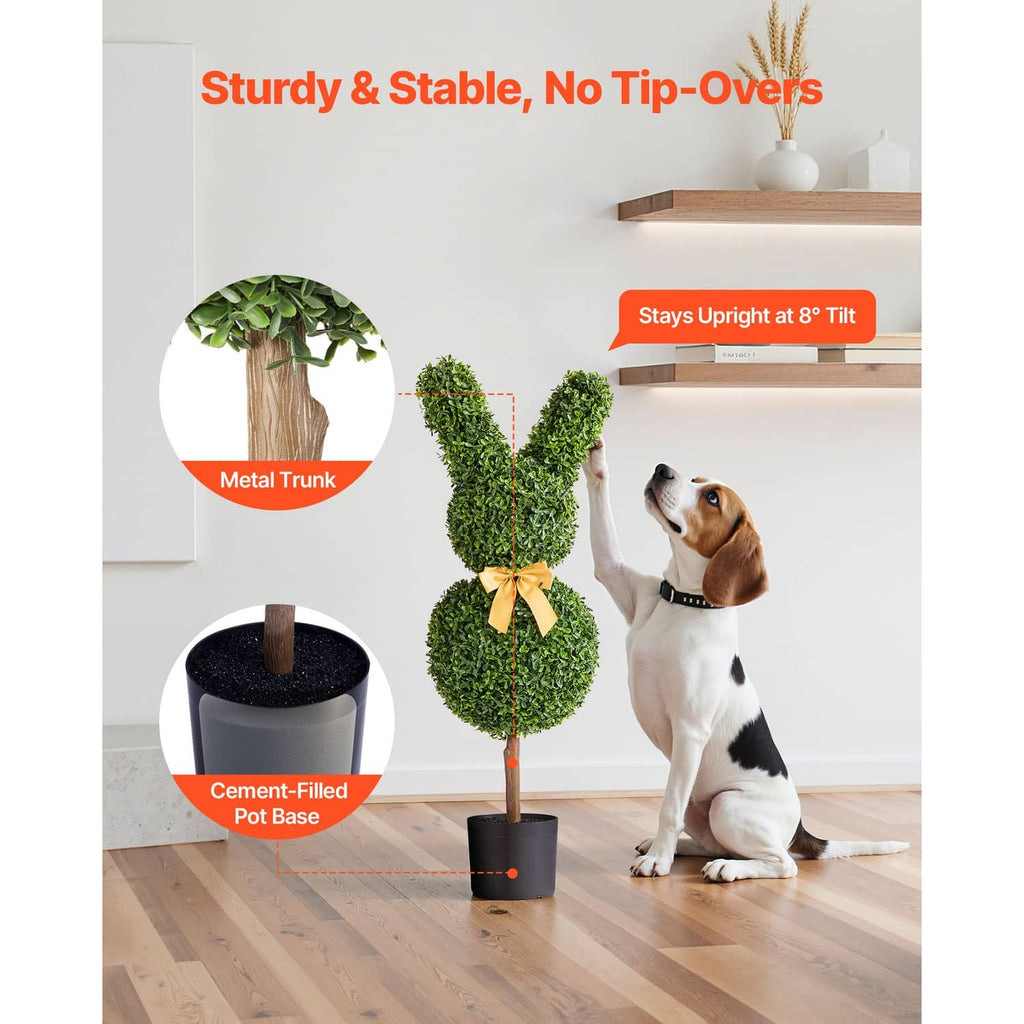 Bunny-shaped boxwood topiary with yellow bow; metal trunk and cement-filled black base.