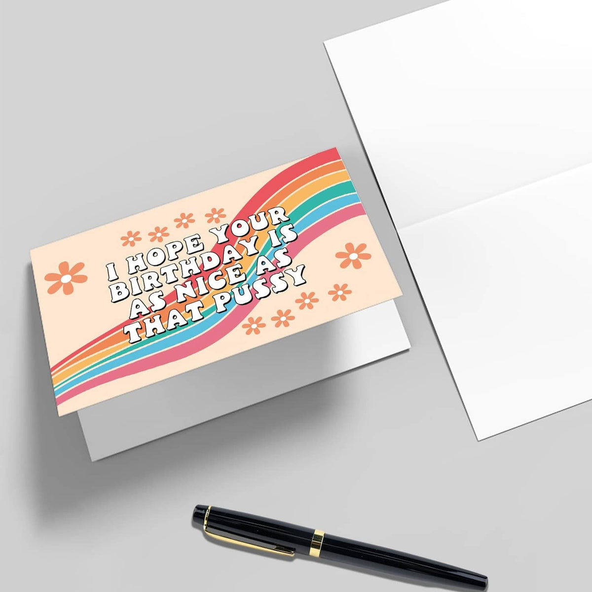 Funny birthday card with rainbow design; message reads “I hope your birthday is as nice as that pussy”