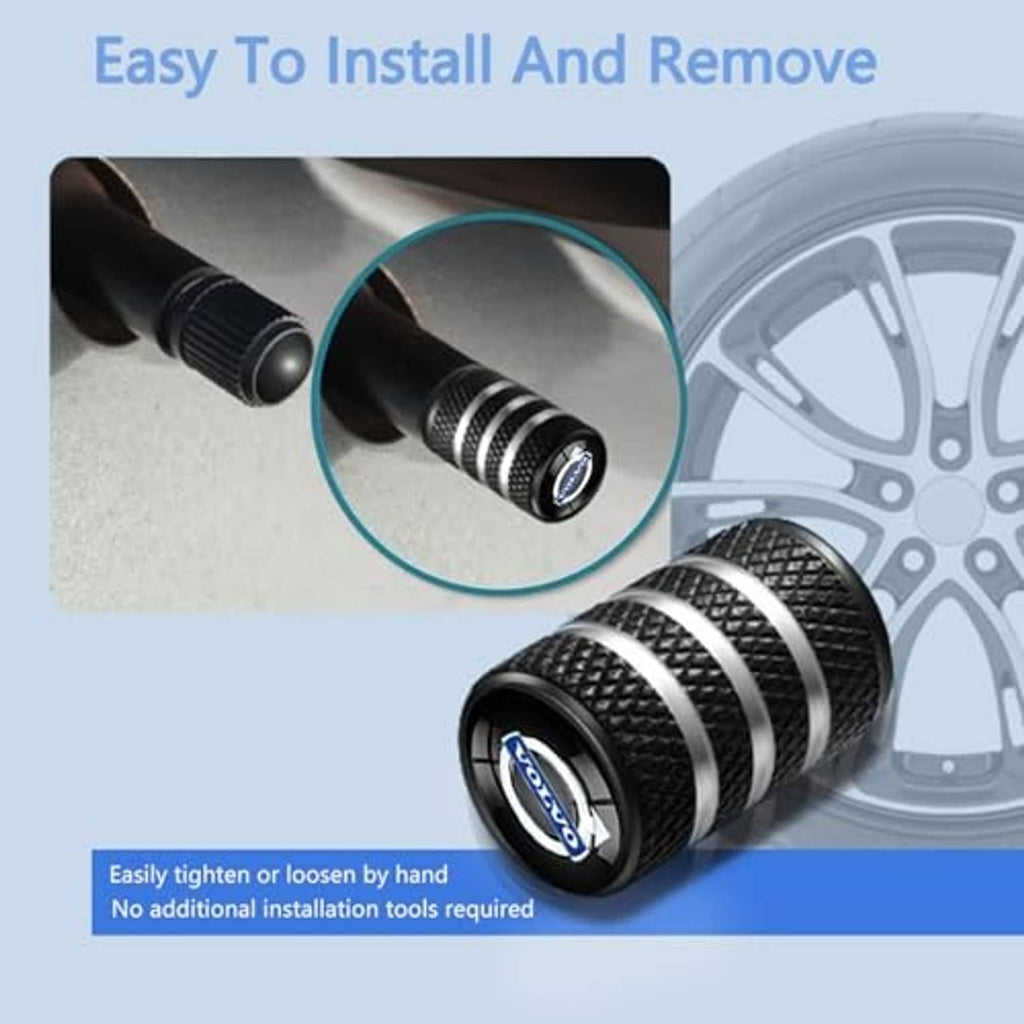 Black textured tire valve stem cap with silver stripes and blue logo on a wheel