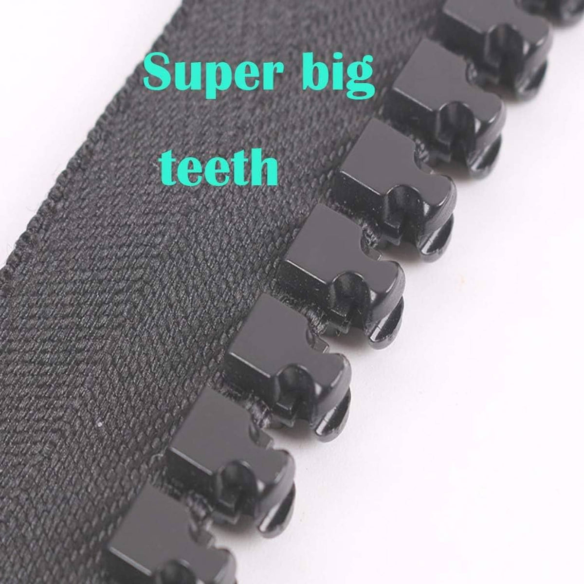 Black plastic zipper teeth close-up with large slider hardware.