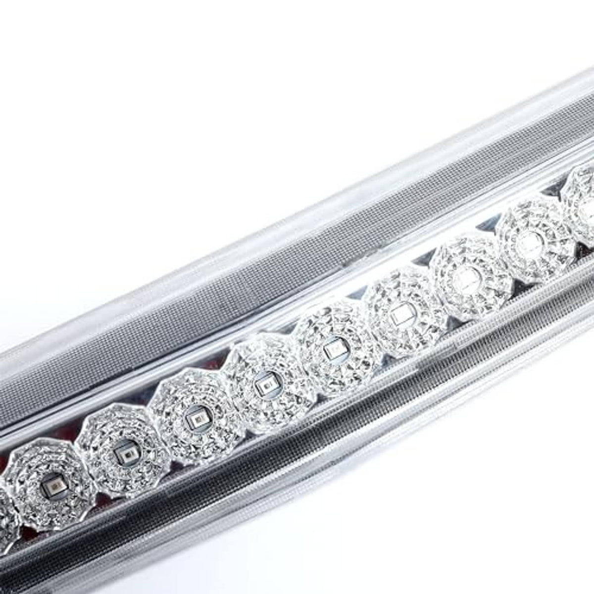 Close-up of rear LED third brake light lens with multiple LED modules under clear cover.