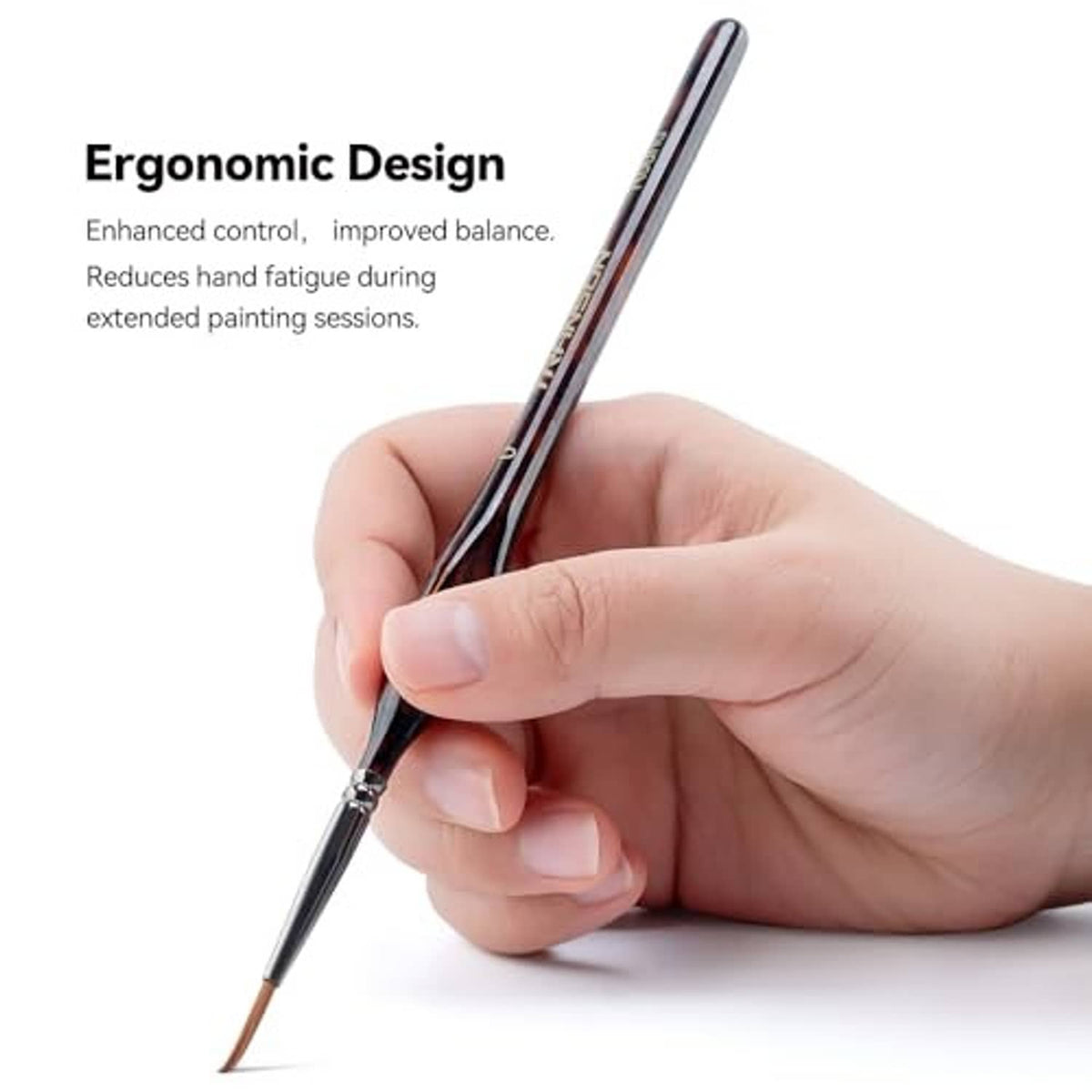 Artist detail paint brush with brown wood handle held in hand, fine tapered tip