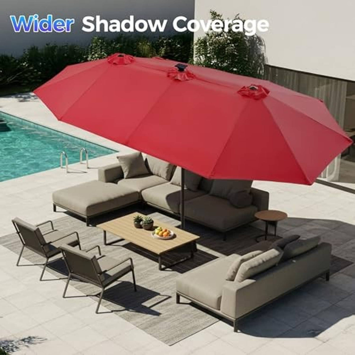 Burgundy patio umbrella open over outdoor seating by a pool.