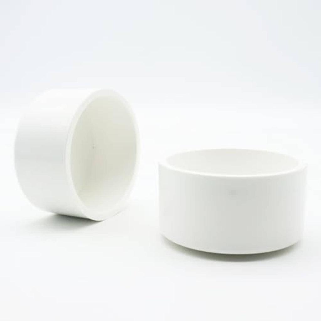 Round white PVC end cap for 2-inch pipe, side view with open interior