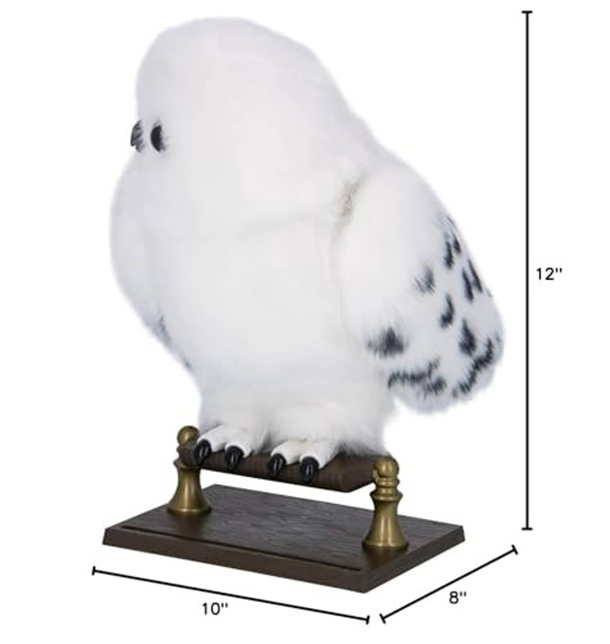 White plush owl with black speckles on dark wooden base with gold posts