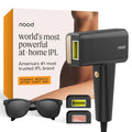 Matte black IPL device with included eyewear and filter cartridges in product box