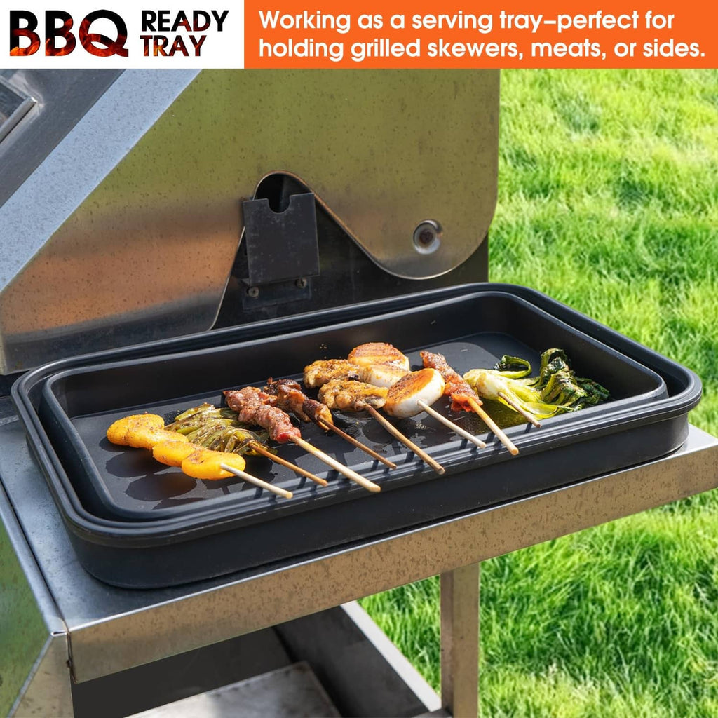 Extra-large collapsible prep tub serving tray on grill, black with skewers and sides