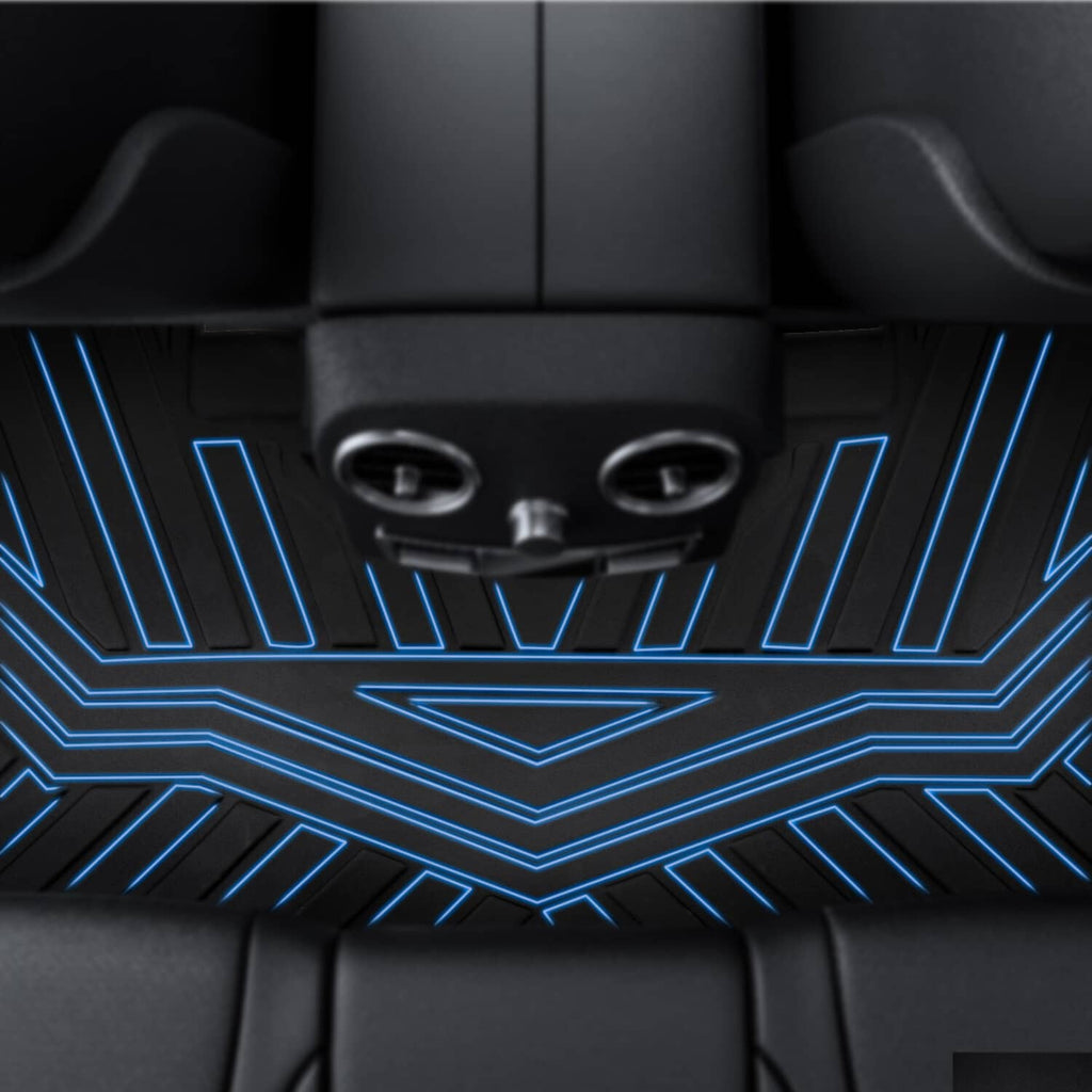 Black TPE floor mat texture with raised ridges beneath vehicle seats