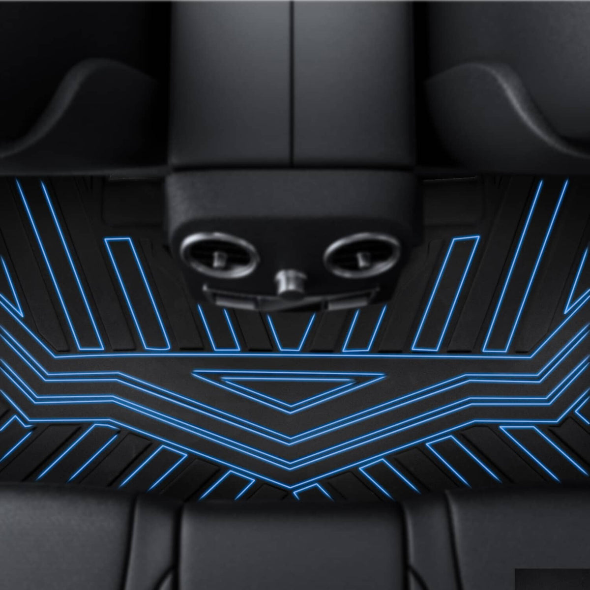 Black TPE floor mat texture with raised ridges beneath vehicle seats