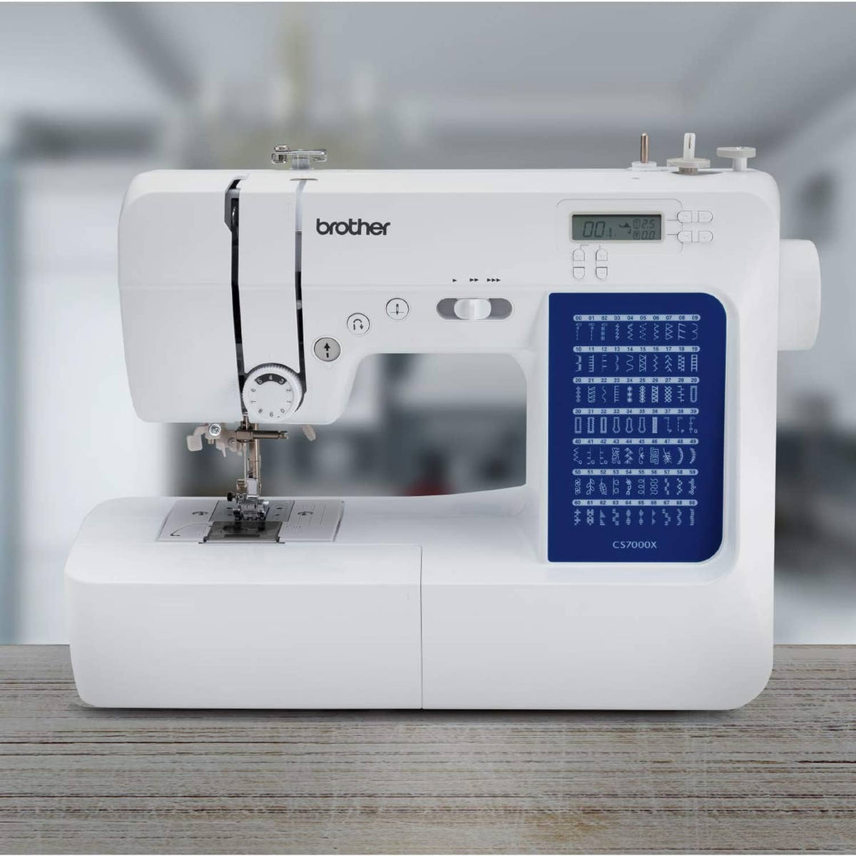 White sewing and quilting machine front view with digital screen and stitch chart
