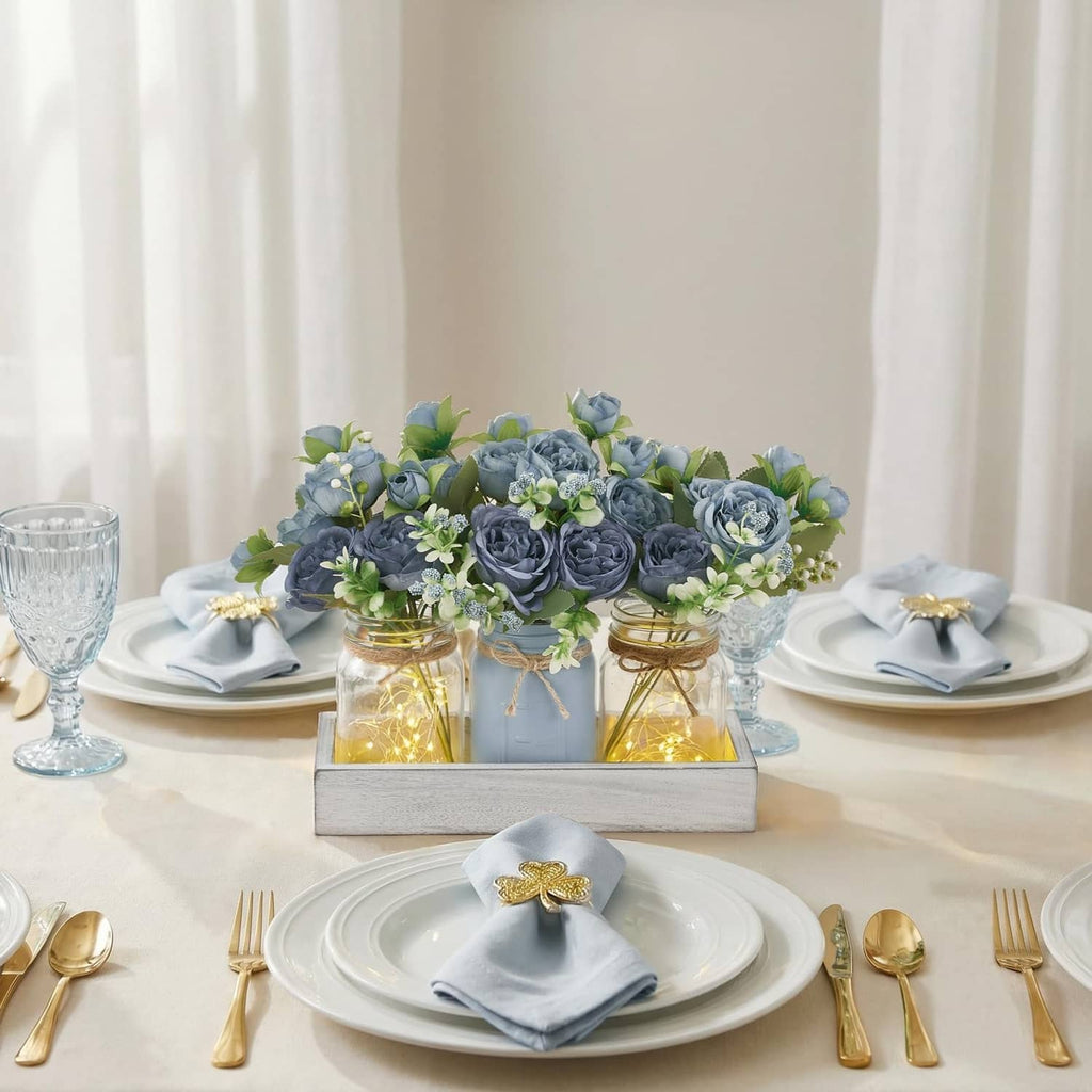 Small mason jar light centerpiece centerpiece with blue flower jars on grey wooden tray