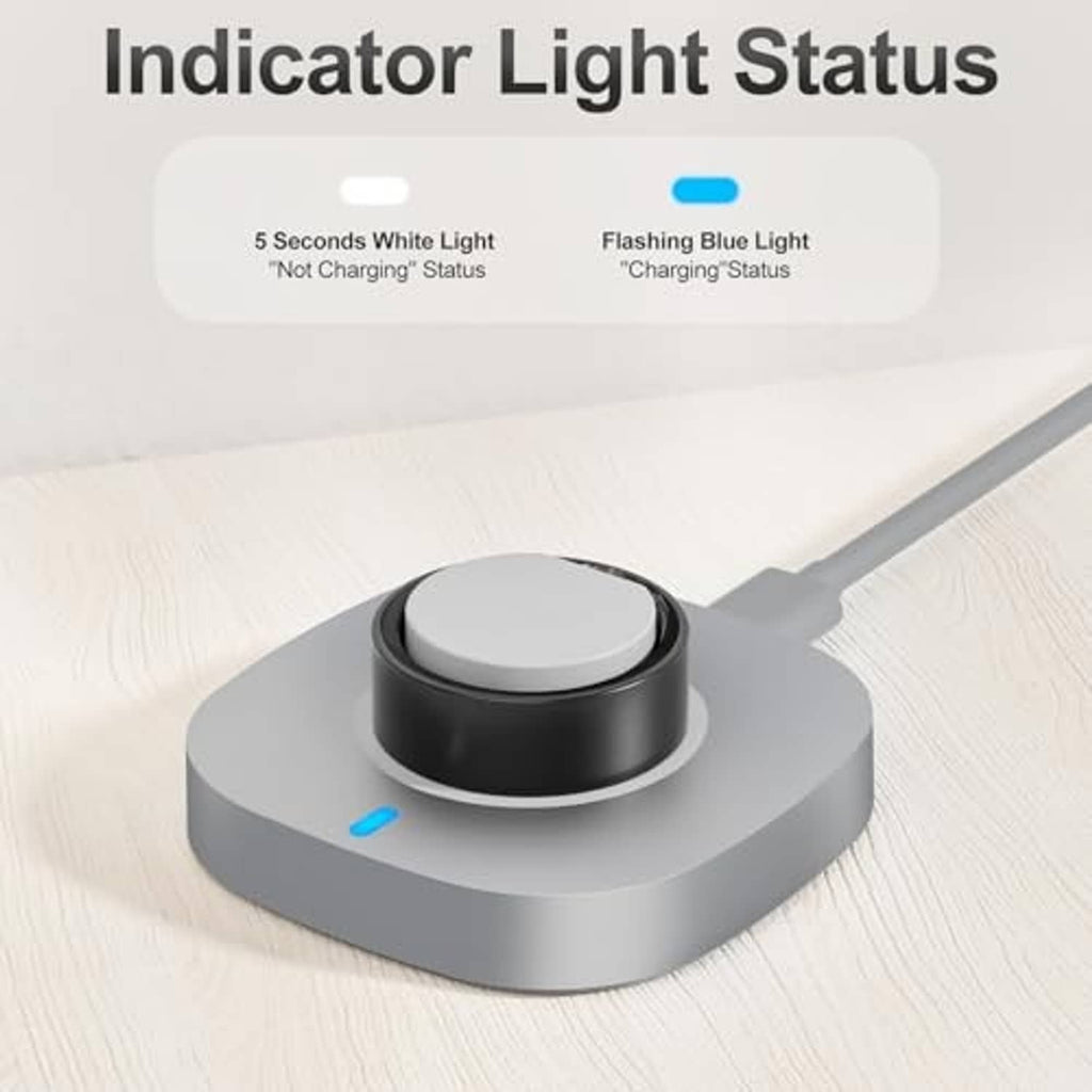 Gray charging dock on a tabletop with black cradle and blue LED