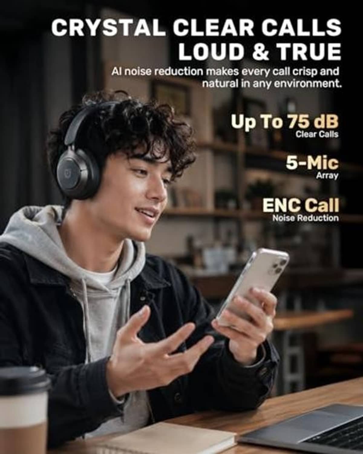 Over-ear black wireless headphones worn by man, smartphone held for calls