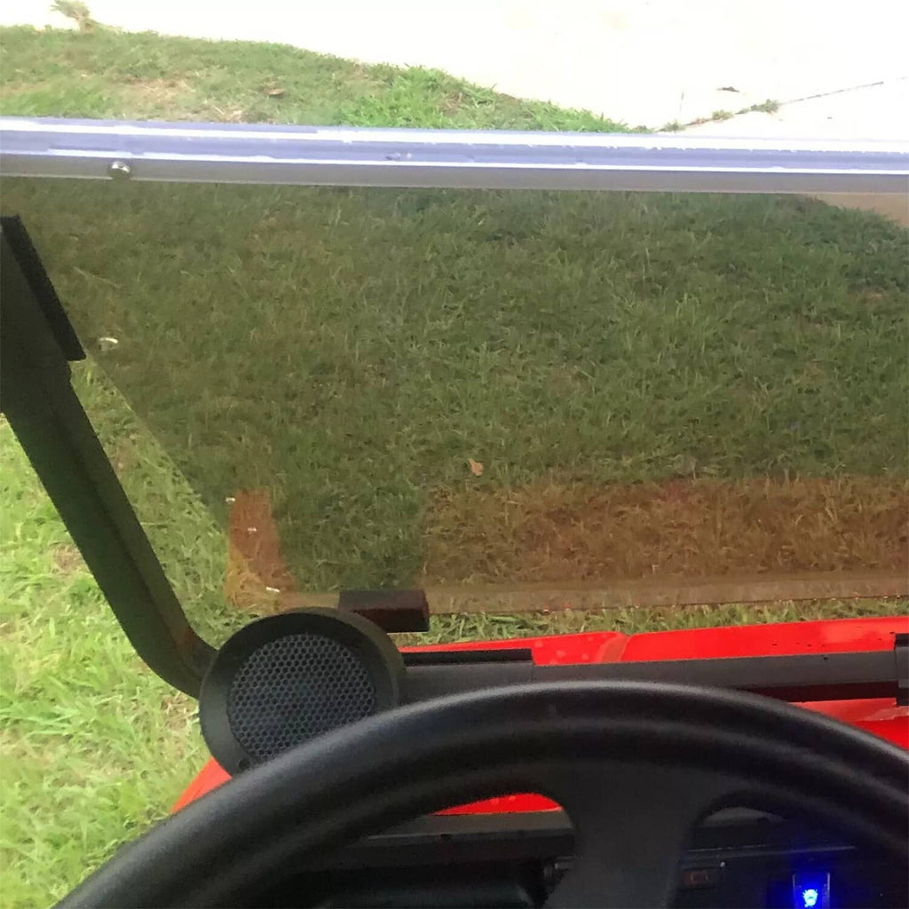 Installed tinted windshield edge on golf cart with black frame supports