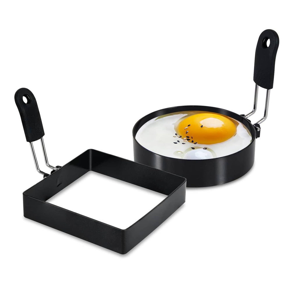 Black egg ring set with round and square molds, black handles on a frying pan