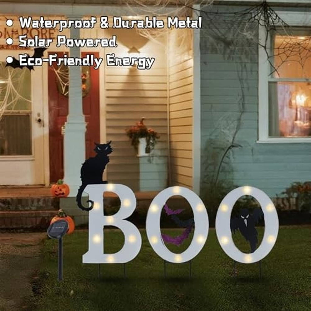 Outdoor BOO solar yard sign set with metal frames, glowing LEDs, and Halloween silhouettes