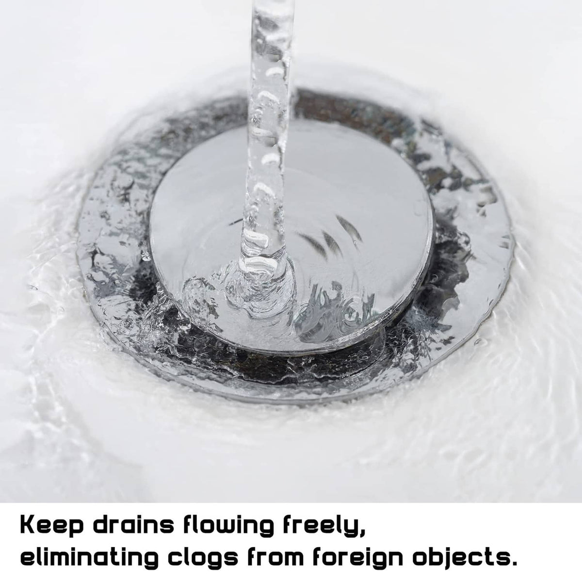 Chrome bathroom sink pop-up stopper head with water draining from the drain hole