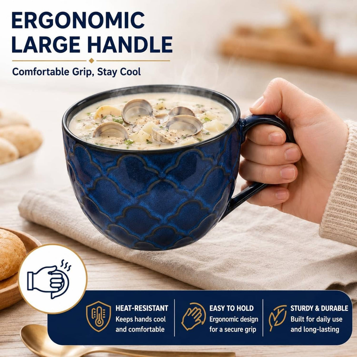 Blue ceramic soup mug with lid and large curved handle, held in one hand.