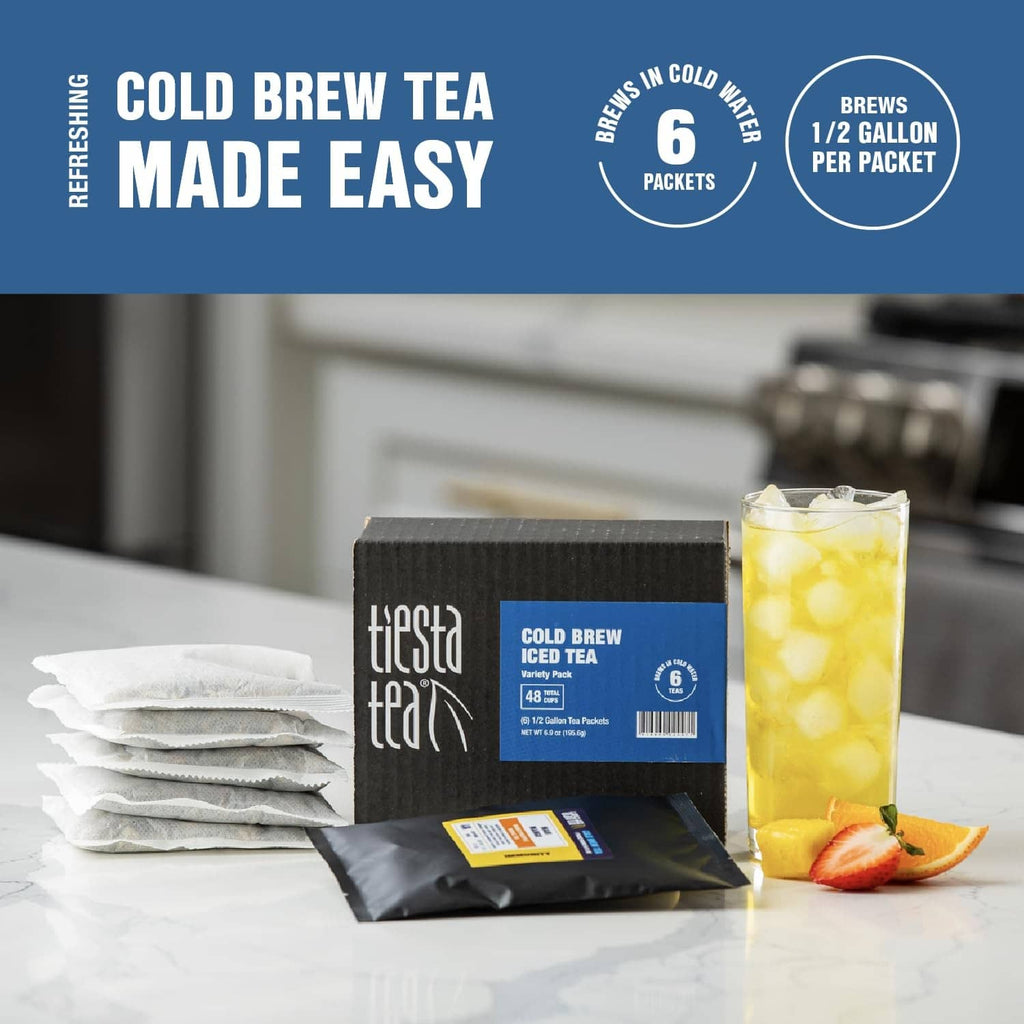 6-pack Tiesta Tea cold brew iced tea packets with stacked sachets and brewed glass