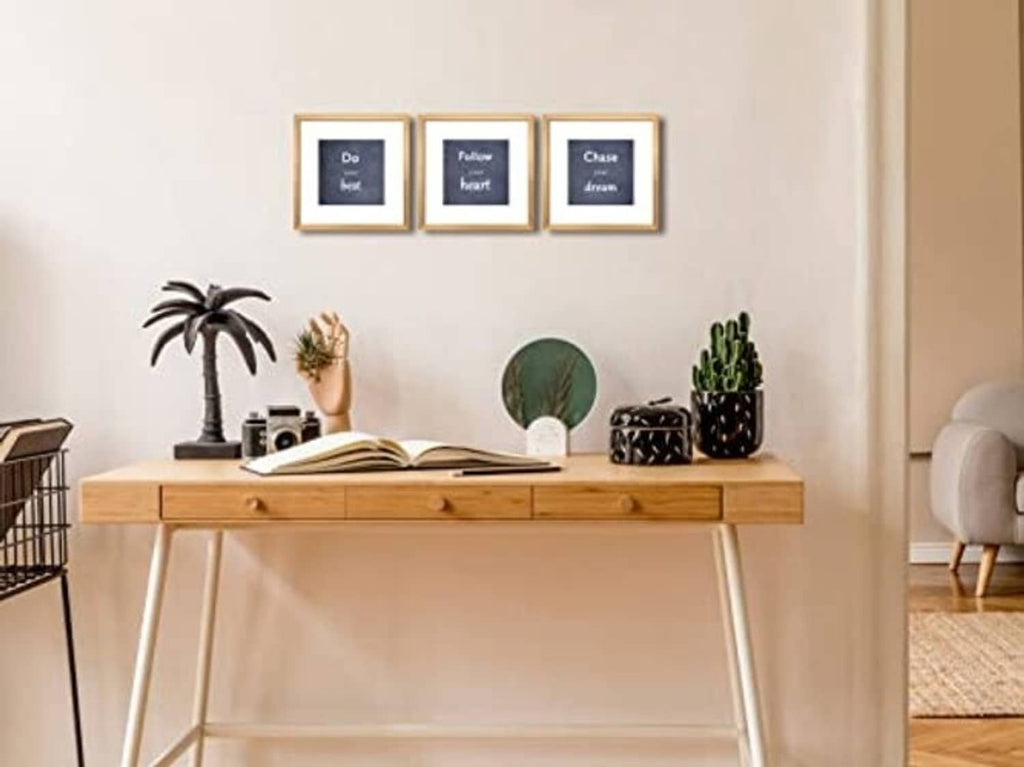 Three small square gold photo frames with real glass, arranged together for display