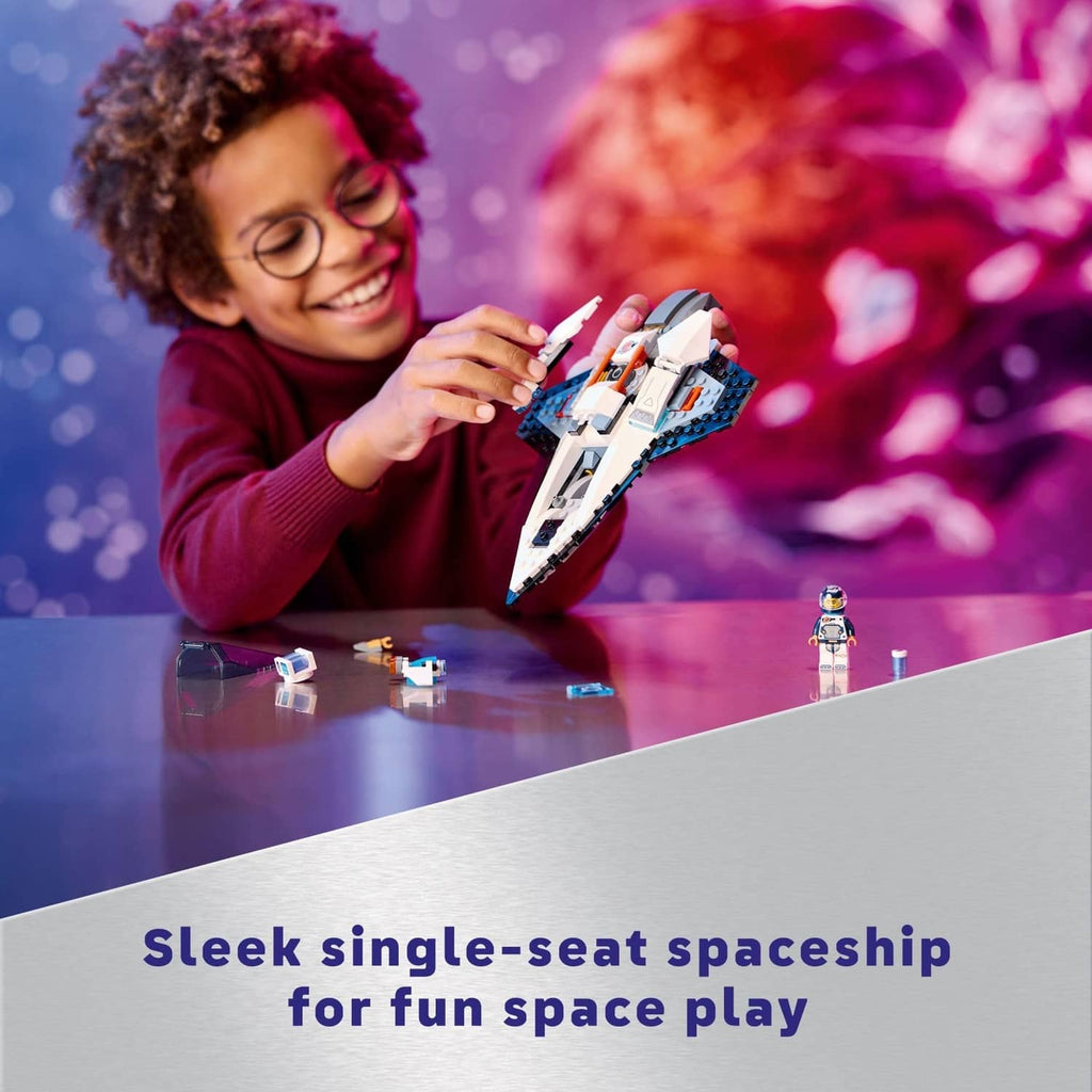 Child playing with the LEGO interstellar spaceship toy model and astronaut minifigure