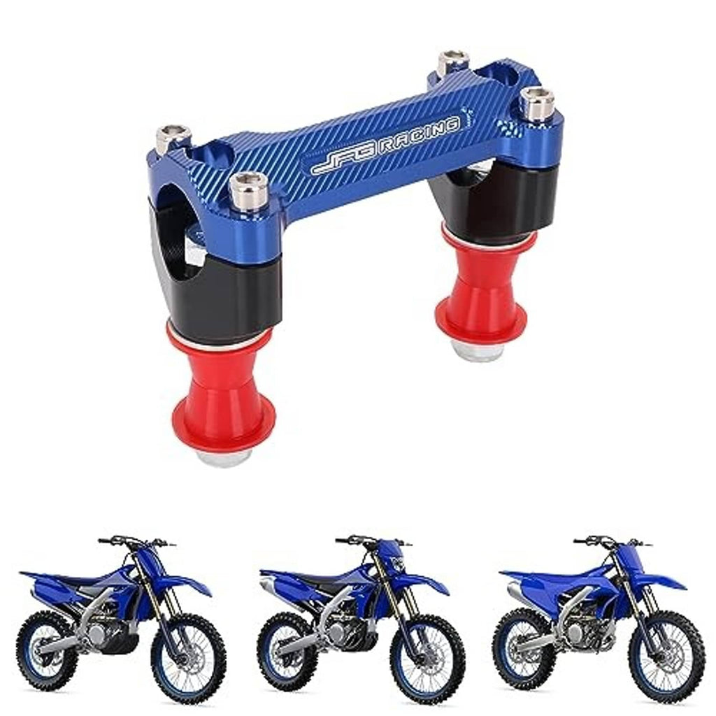 Blue CNC motorcycle handlebar riser with black clamp blocks, red posts, and silver bolts