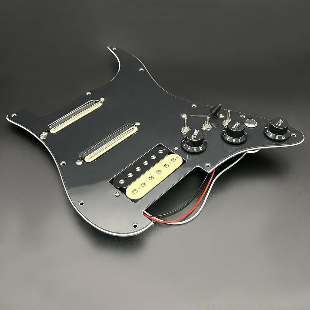Black electric guitar pickguard with three pickups and three control knobs