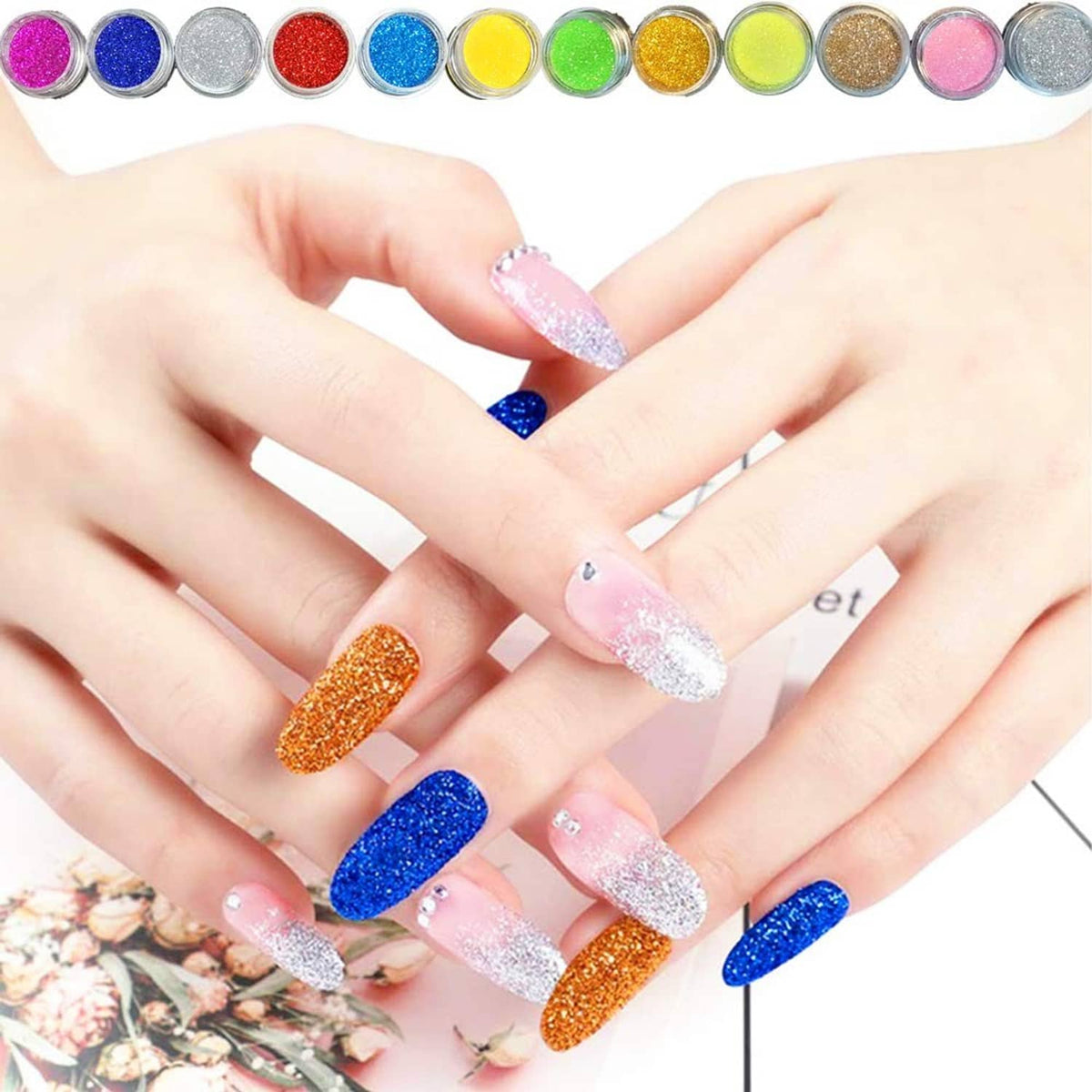 Hands with multi-color glitter acrylic nails including blue, orange, pink, and silver
