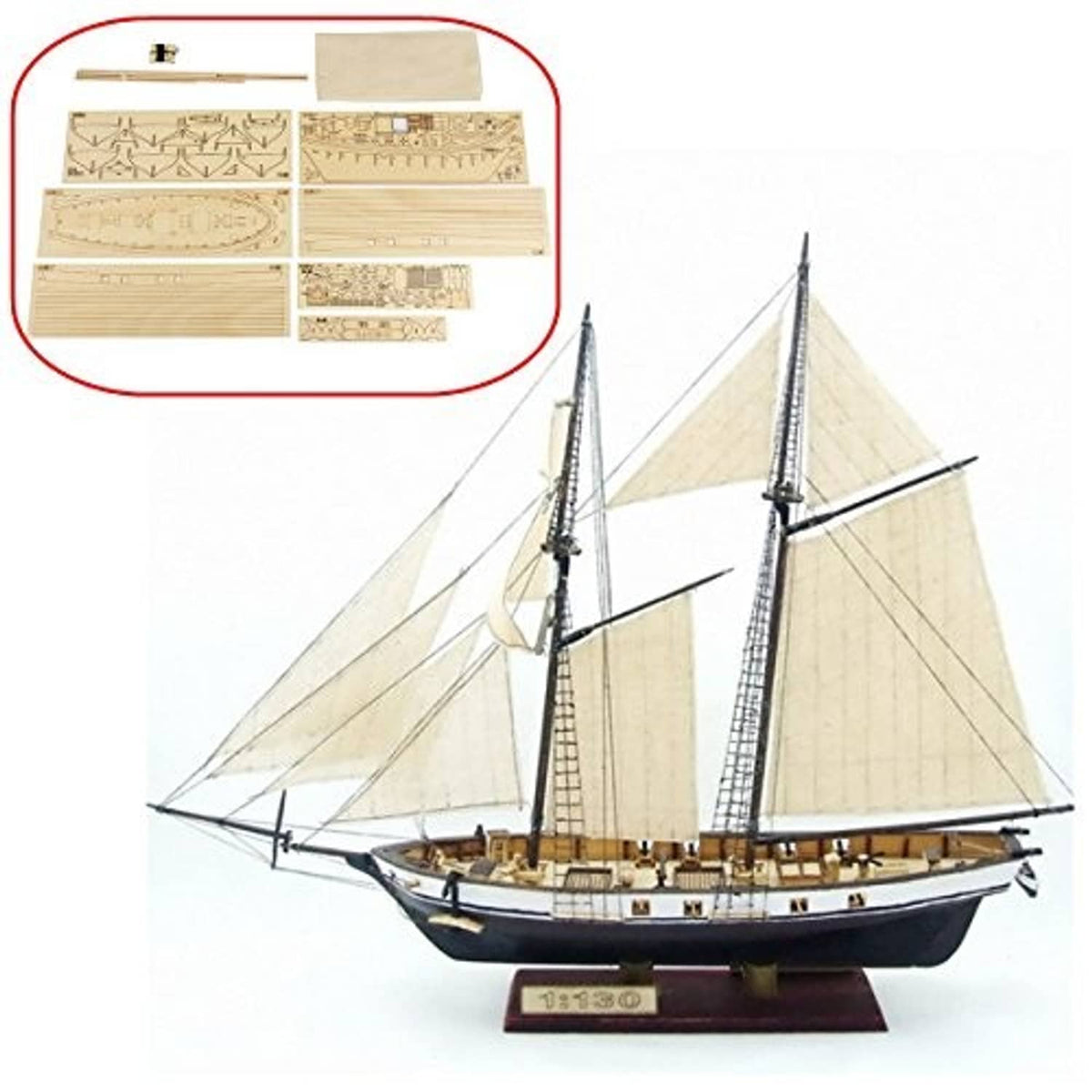 Wooden sailboat model on display with laser-cut wooden assembly sheets