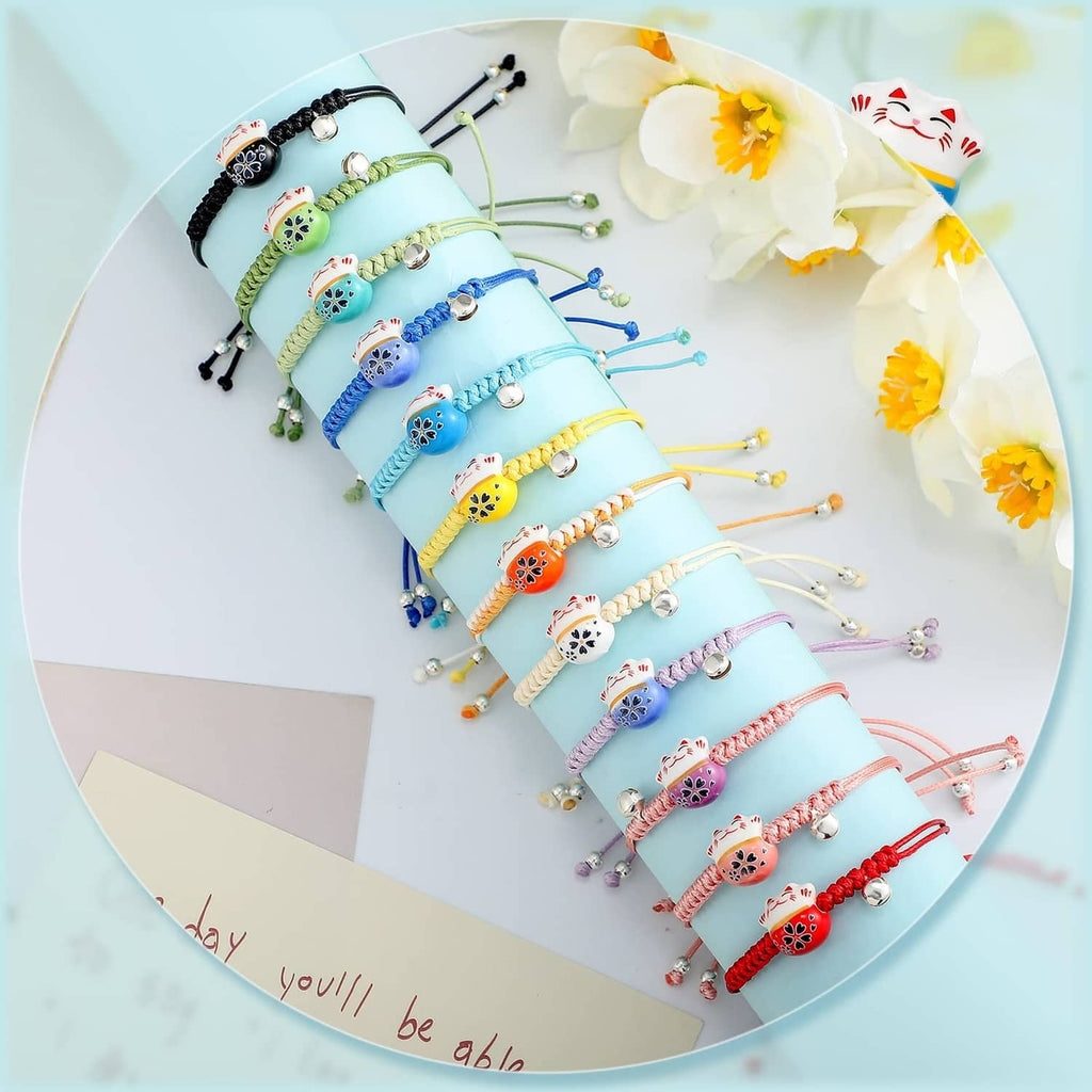 Collection of adjustable braided lucky cat charm bracelets in blue, green, and yellow tones