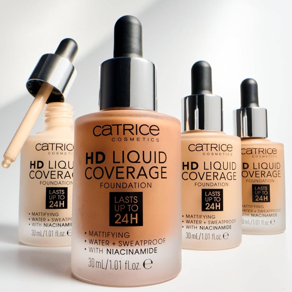 Group of liquid foundation bottles with black pumps, porcelain beige shades