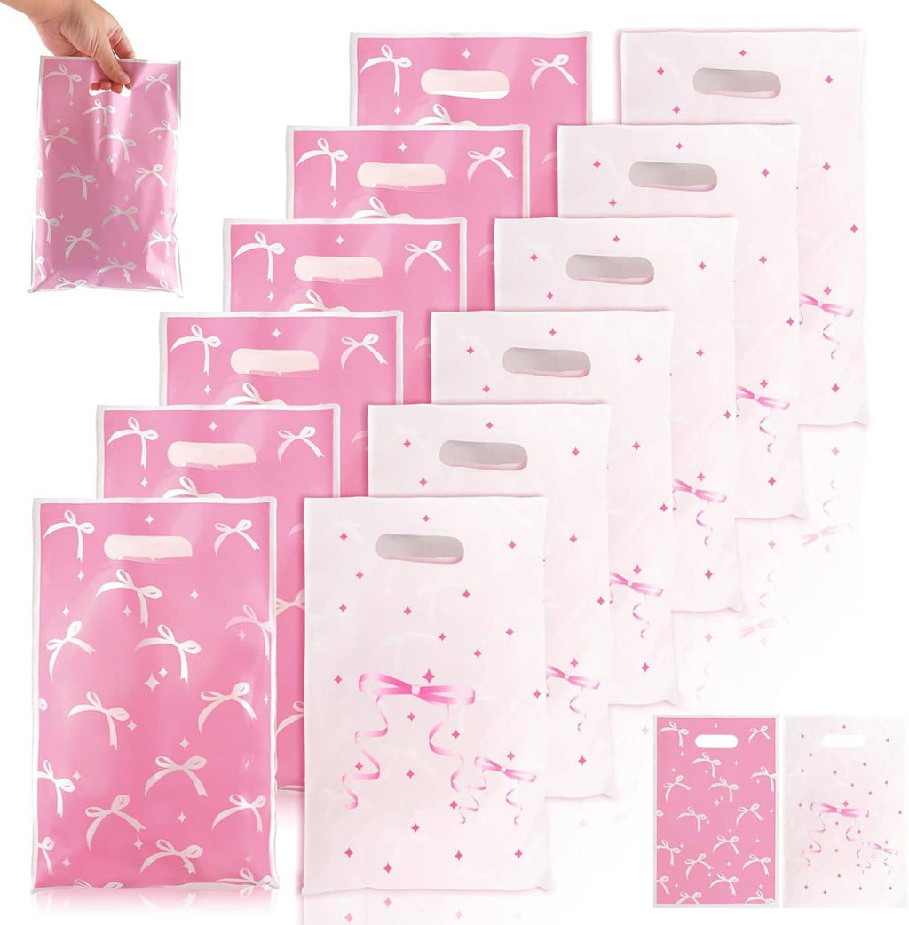 Stack of pink and white treat bags with bow ribbon print and top carry handles
