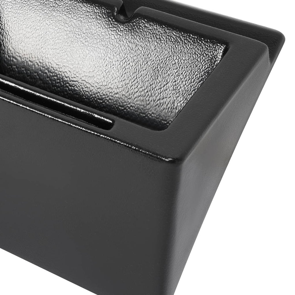 Close-up of black cab caddie top surface and recessed handle opening.