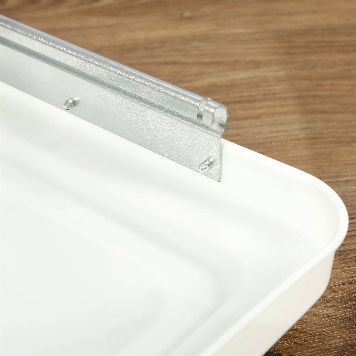 White RV roof vent cover with metal support bar across the lid opening