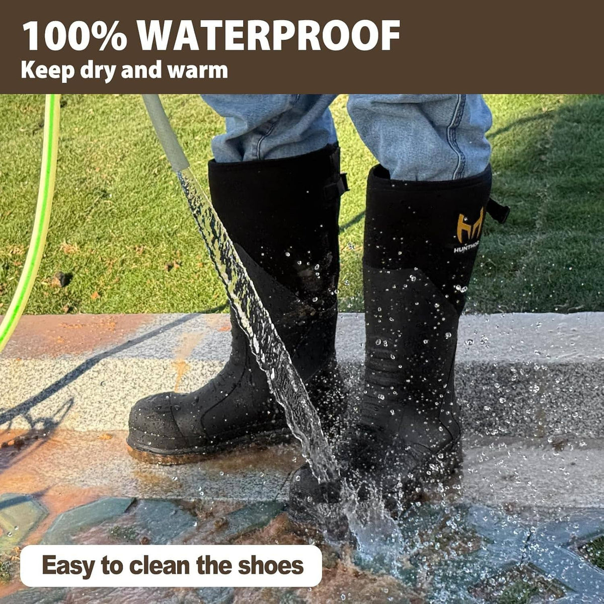Black waterproof work boots splashed with water, muddy traction sole, HUNTHOR logo.