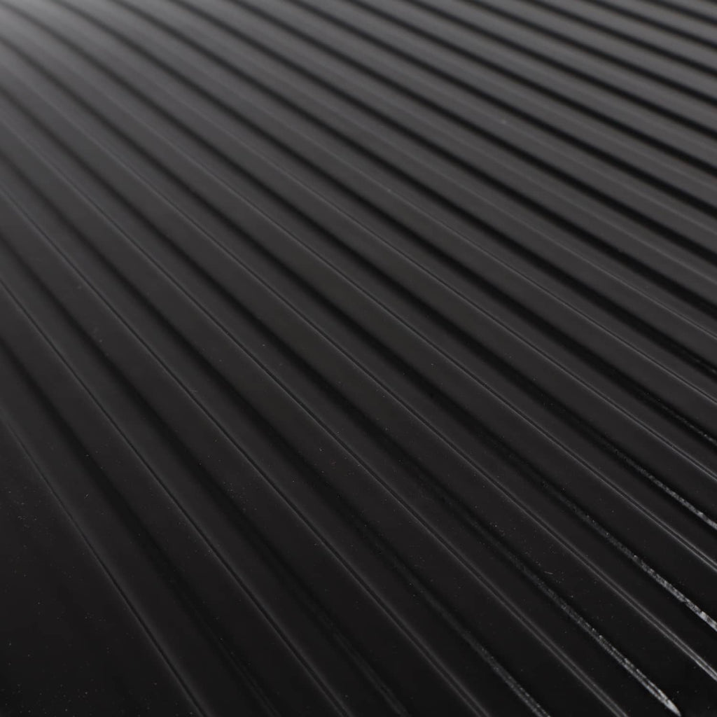 Close-up of black oil pan baffle ribs and cooling channels
