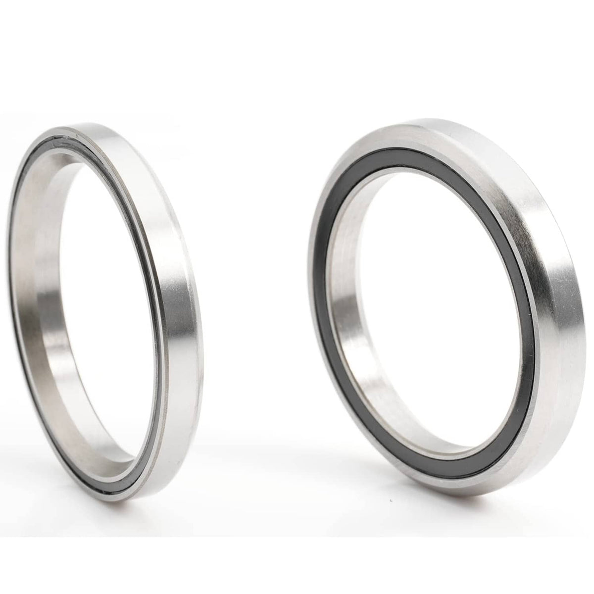 Bike headset bearing rings, close-up metal sides with dark rubber edge