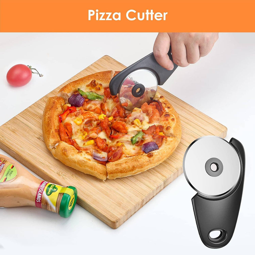 Black pizza cutter tool with round wheel; cutting pizza on a wooden board
