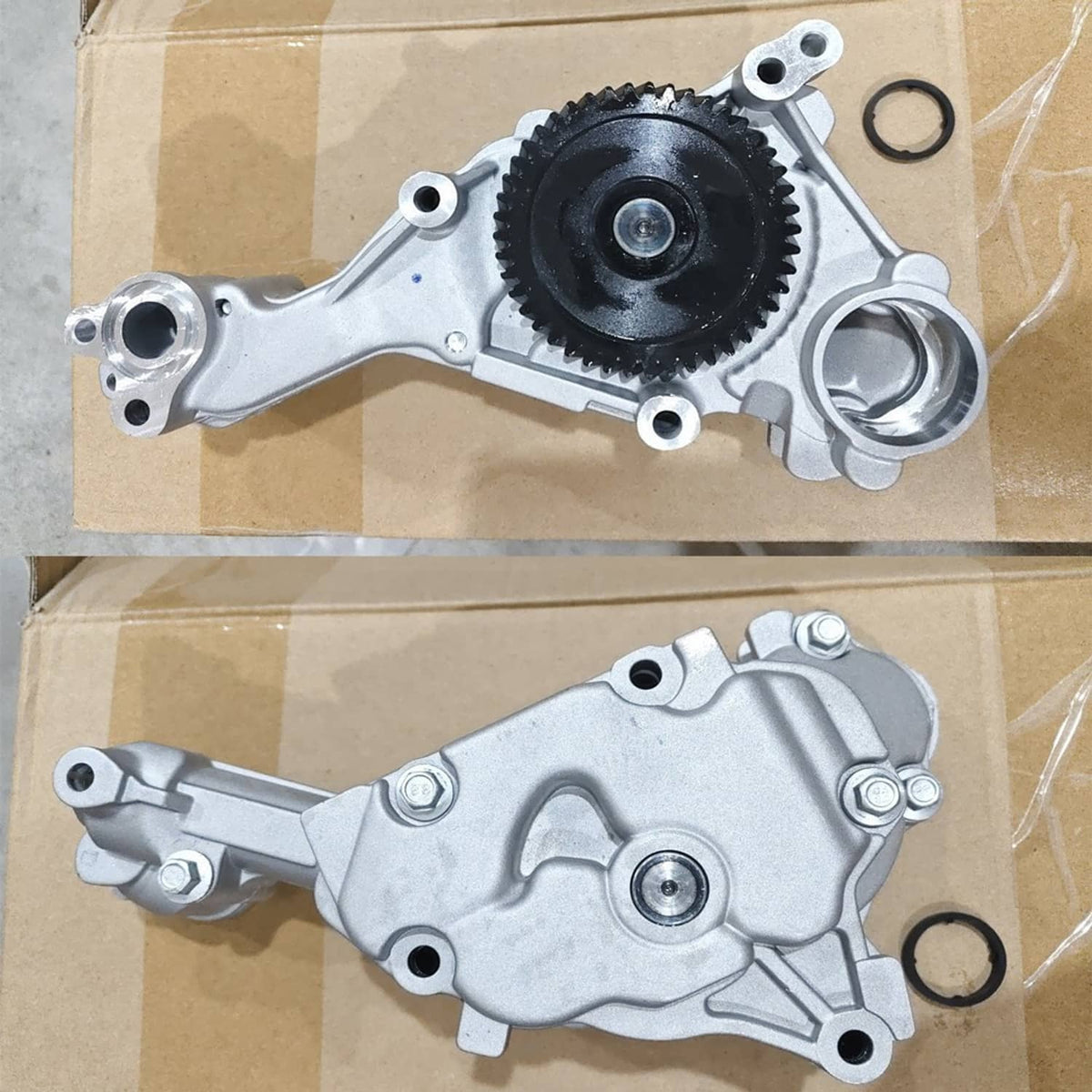 Engine oil pump on cardboard with black gear wheel, silver housing and O-ring seals
