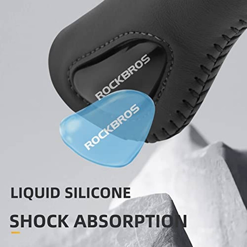 Bike handle grips close-up: black ergonomic gel with blue shock-absorbing insert