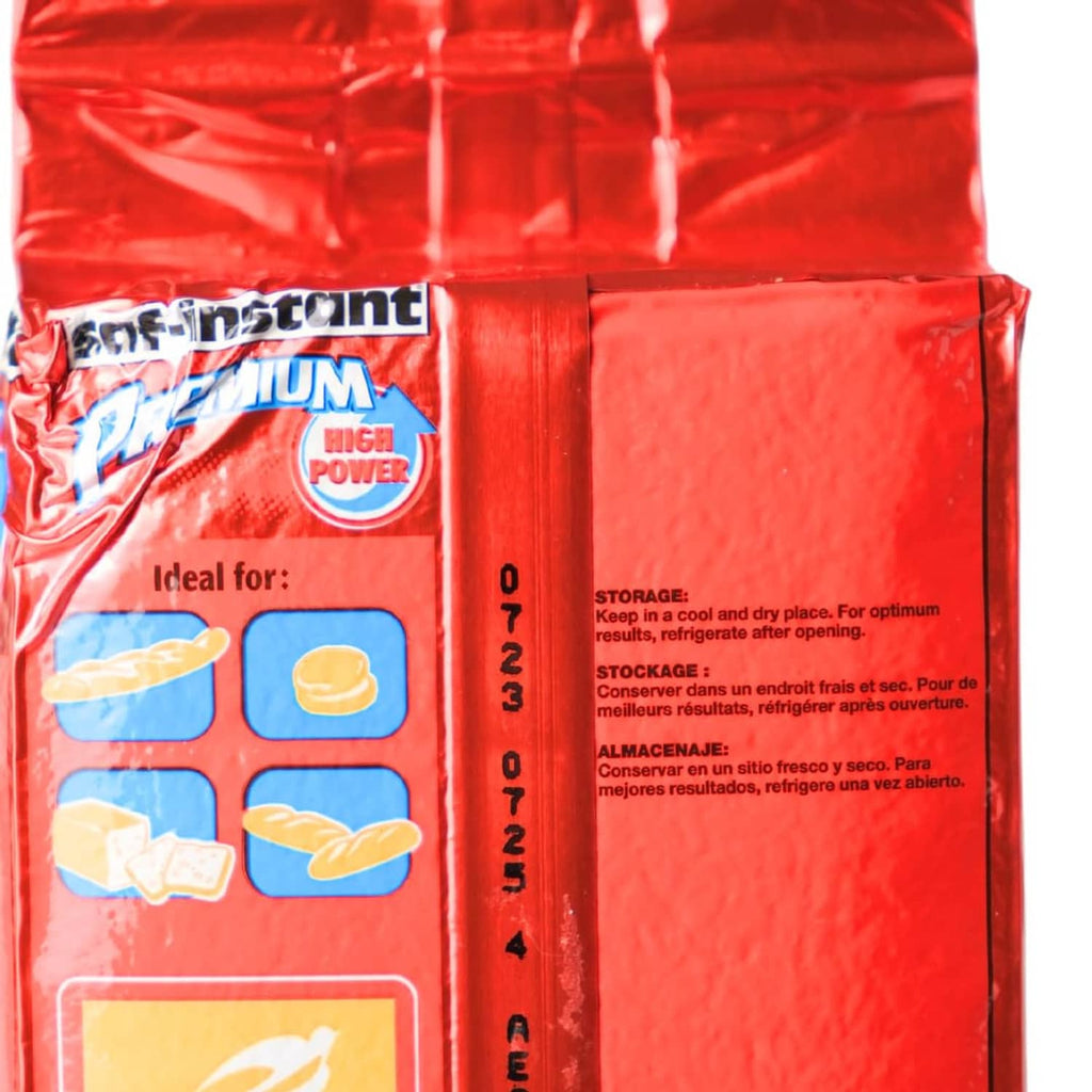 Close-up of red saf-instant yeast pouch side with storage and usage label