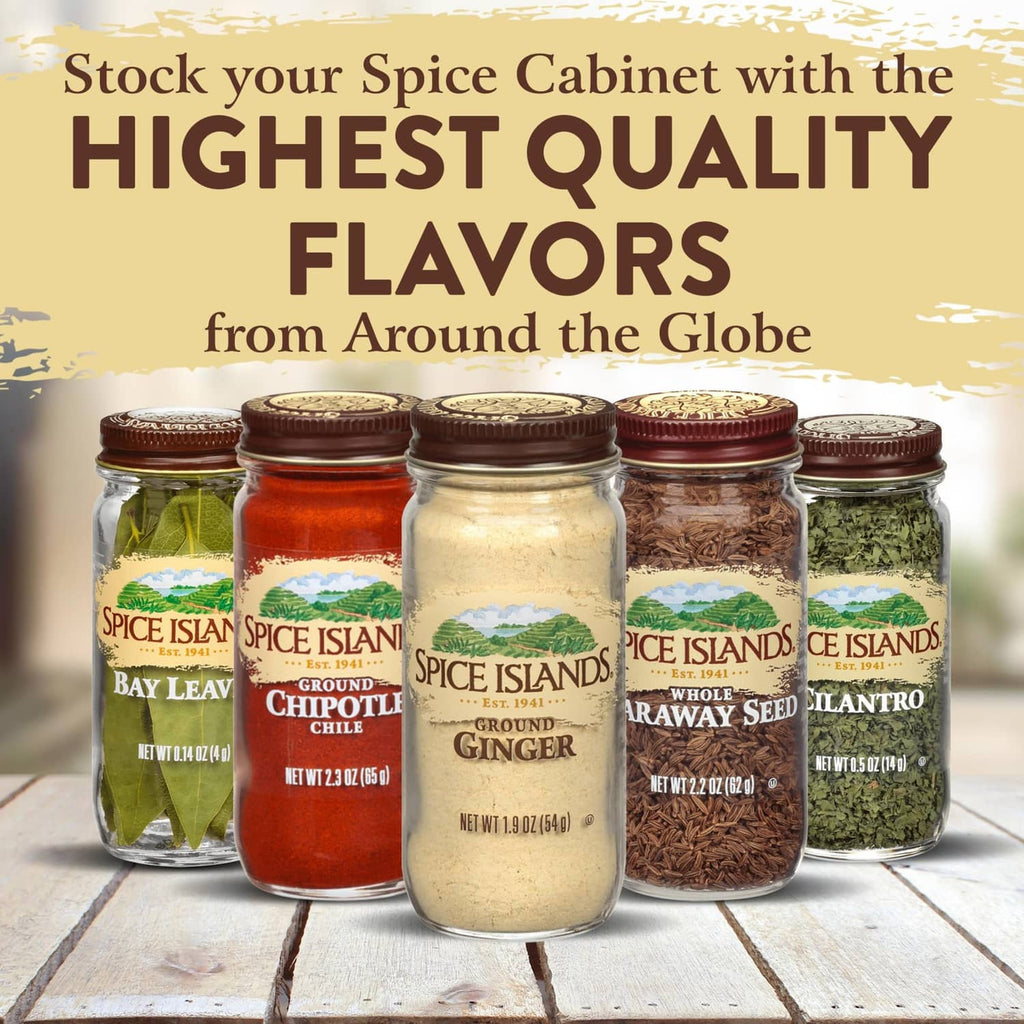 Row of Spice Islands spice jars on a wooden surface